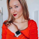 Ladies Sage Gray Double Wrap Apple Watch Leather Band by Juxli Home.  Handmade, stylish leather strap with rose gold hardware on a 40mm Apple watch on a canvas with a black and gray painting.
