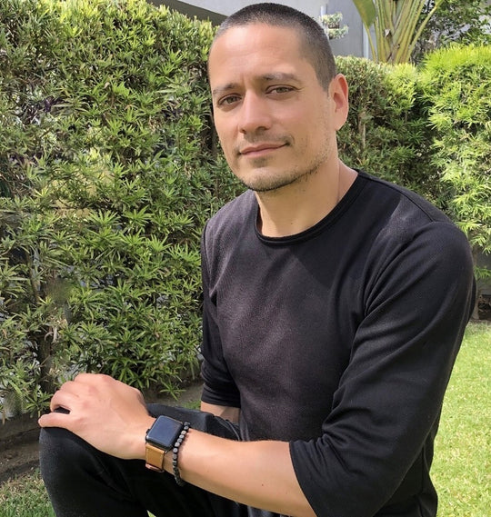 Caramel Brown Apple Watch Leather Band by Juxli Home.  Handmade, stylish leather strap with rose gold hardware on a 40mm Apple watch on a canvas with a black and gray painting.
