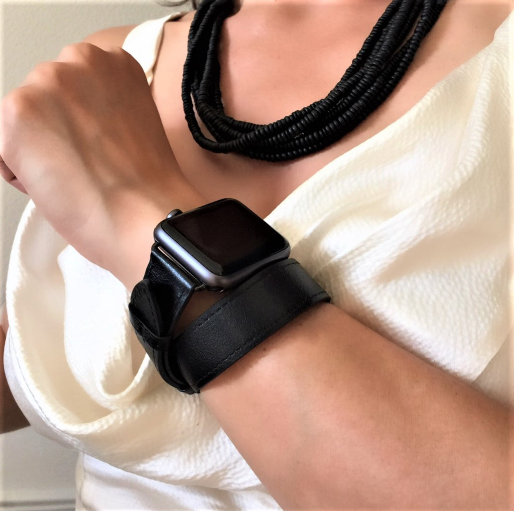 Black apple watch on wrist shop
