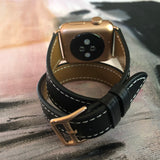 Jet Black Double Wrap Apple Watch Leather Band with White Stitching by Juxli Home.  Handmade, stylish leather strap with rose gold hardware on a 40mm Apple watch on a canvas with a black and gray painting.