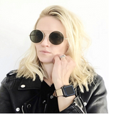 Blush Rose Apple Watch Leather Band by Juxli Home.  Handmade, stylish leather strap with rose gold hardware on a 40mm Apple watch on a canvas with a black and gray painting.