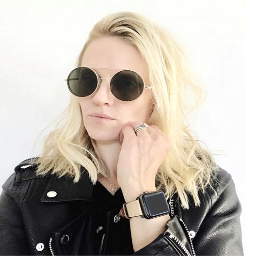 Blush Rose Apple Watch Leather Band by Juxli Home.  Handmade, stylish leather strap with rose gold hardware on a 40mm Apple watch on a canvas with a black and gray painting.