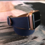 Space Blue Double Wrap Apple Watch Leather Band by Juxli Home.  Handmade, stylish leather strap with rose gold hardware on a 40mm Apple watch on a canvas with a black and gray painting.