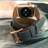 Charcoal Gray Double Wrap Apple Watch Band by Juxli Home.  Handmade, stylish leather strap with rose gold hardware on a 40mm Apple watch on a canvas with a black and gray painting.