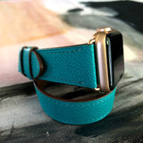 Ladies Sea Green Double Wrap Apple Watch Leather Band by Juxli Home.  Handmade, stylish leather strap with rose gold hardware on a 40mm Apple watch on a canvas with a black and gray painting.