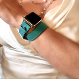 Ladies Sea Green Double Wrap Apple Watch Leather Band by Juxli Home.  Handmade, stylish leather strap with rose gold hardware on a 40mm Apple watch on a canvas with a black and gray painting.