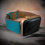Sea Green Apple Watch Textured Leather Band by Juxli Home.  Handmade, stylish leather strap with rose gold hardware on a 40mm Apple watch on a canvas with a black and gray painting.