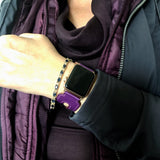 Rasin Purple Apple Watch Double Buckle Cuff by Juxli Home.  Handmade, stylish leather strap with rose gold hardware on a 40mm Apple watch on a canvas with a black and gray painting.