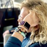 Rasin Purple Apple Watch Double Buckle Cuff by Juxli Home.  Handmade, stylish leather strap with rose gold hardware on a 40mm Apple watch on a canvas with a black and gray painting.