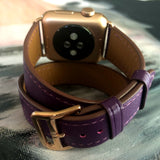 Rasin Purple Double Wrap Apple Watch Leather Band for Women by Juxli Home.  Handmade, stylish leather strap with rose gold hardware on a 40mm Apple watch on a canvas with a black and gray painting.