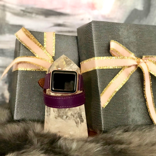 Rasin Purple Double Wrap Apple Watch Leather Band for Women by Juxli Home.  Handmade, stylish leather strap with rose gold hardware on a 40mm Apple watch on a canvas with a black and gray painting.