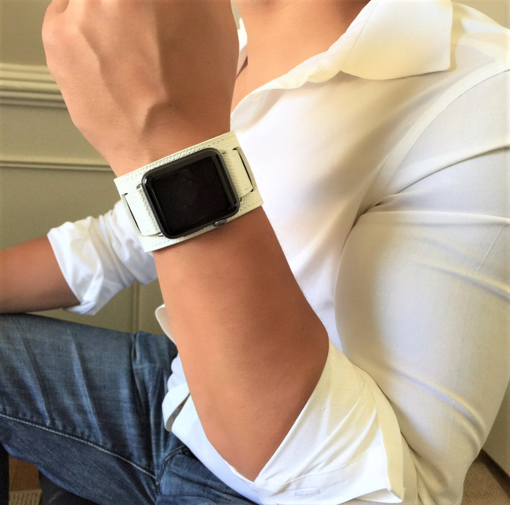 White apple watch on wrist top