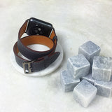 Charcoal Gray Double Wrap Apple Watch Band by Juxli Home.  Handmade, stylish leather strap with rose gold hardware on a 40mm Apple watch on a canvas with a black and gray painting.