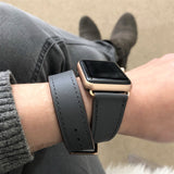 Charcoal Gray Double Wrap Apple Watch Band by Juxli Home.  Handmade, stylish leather strap with rose gold hardware on a 40mm Apple watch on a canvas with a black and gray painting.