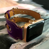 Rasin Purple Apple Watch Double Buckle Cuff by Juxli Home.  Handmade, stylish leather strap with rose gold hardware on a 40mm Apple watch on a canvas with a black and gray painting.