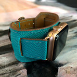 Sea Green Apple Watch Leather Cuff by Juxli Home.  Handmade, stylish leather strap with rose gold hardware on a 40mm Apple watch on a canvas with a black and gray painting.
