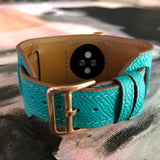 Sea Green Apple Watch Leather Cuff by Juxli Home.  Handmade, stylish leather strap with rose gold hardware on a 40mm Apple watch on a canvas with a black and gray painting.