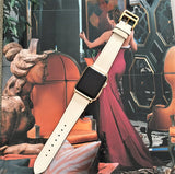 Ivory Apple Watch Leather Band by Juxli Home.  Handmade, stylish leather strap with rose gold hardware on a 40mm Apple watch on a canvas with a black and gray painting.