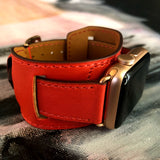 Fire Red Apple Watch Leather Cuff by Juxli Home.  Handmade, stylish leather strap with rose gold hardware on a 40mm Apple watch on a canvas with a black and gray painting.