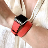 Fire Red Double Wrap Apple Watch Leather Band by Juxli Home.  Handmade, stylish leather strap with rose gold hardware on a 40mm Apple watch on a canvas with a black and gray painting.